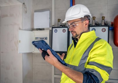electrical-technician-looking-focused-while-working-switchboard-with-fuses_169016-23720 (1)